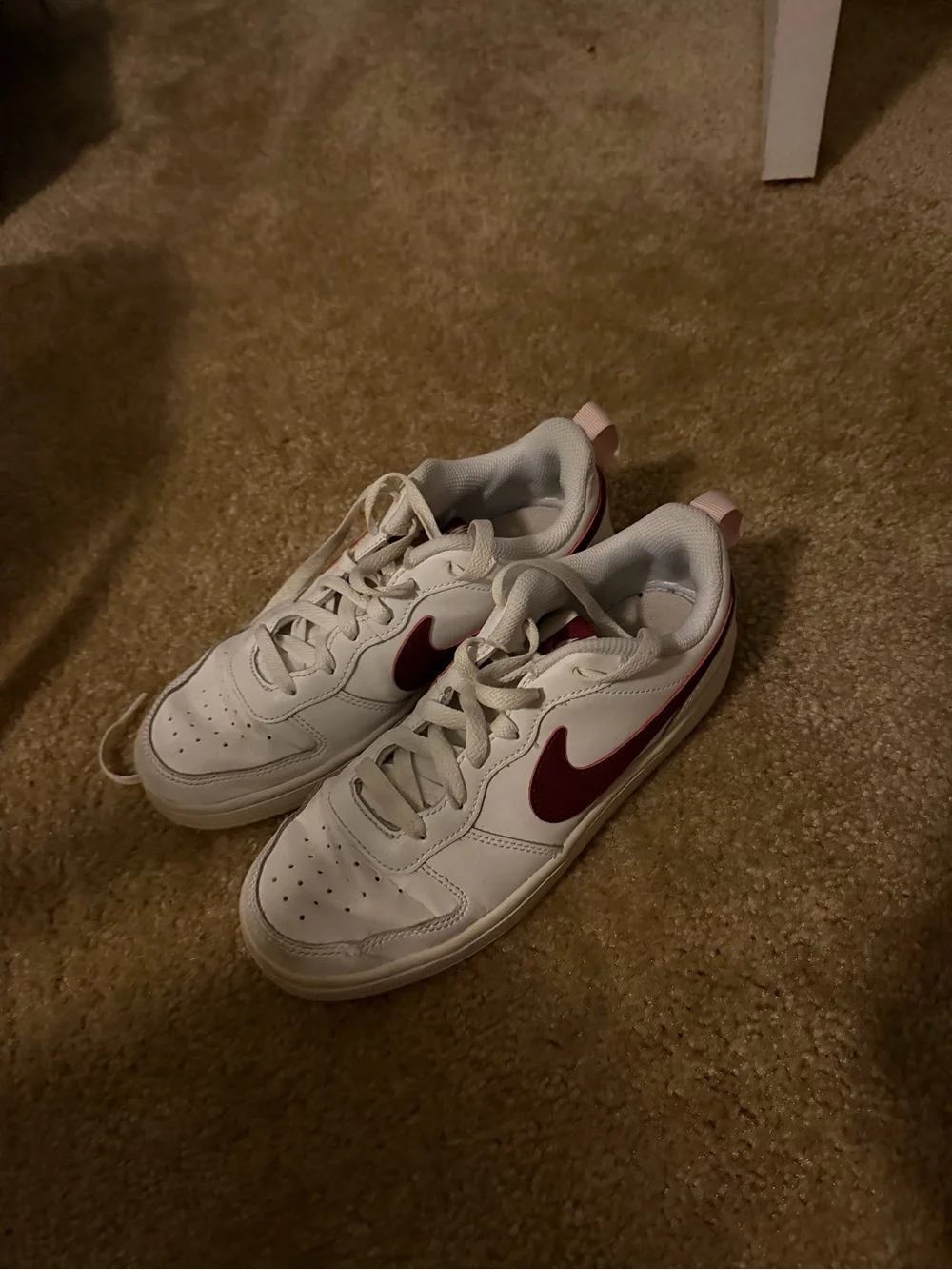 Nike Kids White Sneakers with Maroon Swoosh and Pink Accents